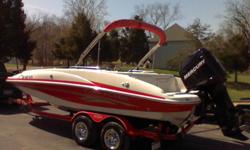 2006 tahoe deck boat. Has 200 mercury outboard. has max of 30 hours on it. paid 41000 boat is red and white. trailor is red