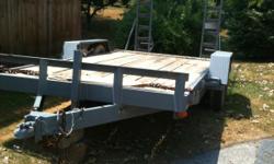 12,000 lb. car hauler trailer. New brakes, paint, lights. Two adjustable metal ramps that lock in the upraised position when not in use.