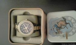 Brand new Chocolate Fossil watch never worn, paid $150.00 asking $70.00