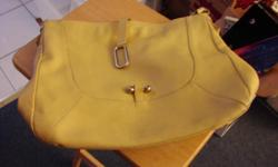 Nice Furla Italian leather purse in good condition. The color is a creamy yellow. Has nice big handle. Purse body measures approximately 17 1/2 inches wide and 13 inches high. Handle measures approximately 6 inches from the top of the purse to the top of