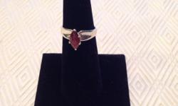 This gorgeous genuine Garnet sterling silver is a size 7,
but there are a limited number of this style ring in other
sizes. It is marked $33.00, but will only cost you $24.75
during the 25% off sale currently in progress. Please shop
with us in Case 116