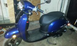 Bran new gas moter scooter goes 40 miles hour one year old runs good one little scratch got clear title cash only