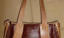 Geniune leather brown handbag - Made in Brazil. EXCELLENT condition. Gorgeous bag, with 2 tones of brown. Weave pattern
PayPal or Google Checkout accepted. I have a 100% seller rating on Ebay (under the account name of hollybee75)
FEEL FREE TO MAKE ME AN