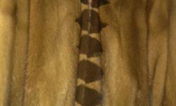 Genuine Mink Coat for sale-purchased in Winnipeg, Canada. &nbsp;Coat length is below waist and in immaculate condition (worn twice). &nbsp;Year round elegance in any attire worn with this mink coat. &nbsp;Matching small shoulder bag (genuine mink)