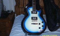 Beautiful les paul copy guitar.Blue and white. One of a kind, none like it. Humbucker pick ups, grover turners, redwood neck. Frets great, no buzz . NEW never played with new case.