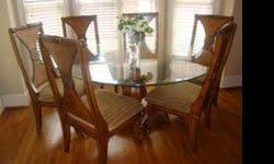 Beautiful 60" glass top dining table with ornate oak finish base and 6 chairs, tastefully upholstered. Bought new from Rooms To Go, paid $1500, still in new condition. Buyer must pick up, will not ship or deliver.