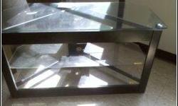 GLASS TV STAND LIKE NEW!!!!NO SCRATCHES!!!! GLASS AND BLACK.. HOLD UP TO 42"TV!!!!PERFECT CONDITION....