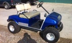 Golf cart lifted with aluminum wheels (gas).