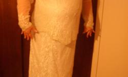 White beaded gown is a size 20 and the Black with purple flowered jacket is size 18. Each gown is $40.00