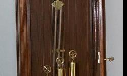 This is about 1 year old and cable drive Weastminister Chime Moon fase dial . The size of the clock is 6'8" tall x 21" wide x 12"thick .The dial is 15"L x10 1/2"W. Pendulum bob is 9" Dia. It Has glass side panals so you can see the movement working.
PRICE