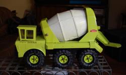 This is an old 1970's metal Tonka Cement Truck. In great condition. There are some scratches, but no dents or rust. The wheels move freely and the dump barrel moves by cranking a metal crank. Dump shoot is moveable from side to side.