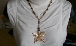 hand crafted butterfly necklaces,glass an mother of pearl, an tigers eye.$30.00 each