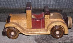 HAND CRAFTED WOODEN CAR BY STRETCH
Pre-Owned
Car is in excellent condition ? looks brand new
This item is well made, with very sturdy wood, wheels do turn and the back opens up for a Rumble Seat.
This car would be nice to add to your collection of wooden