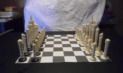 Ivory Chess Set. King(s) 8", Queen 6 3/4", Base 1 7/8", Bishop 5 7/8", Knight 5", Rook (Castle) 4 1/4", Pawn 3 1/2". Excellent Condition, Hand made. Rare set. Buyer must pickup or arrange for shipping, (Will assist)