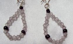 Secured by a hook back 1 1/2 inch dangle with a tear drop shape loop, hand made of clear & smoke crystal like bicone beads accented with 3 black round beads
Please Visit Us @ WWW.CSHANDCRAFTEDTREASURES.COM