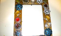 Handmade mirrors/picture frames.&nbsp; I can make them in the color of your choice.&nbsp; Email me for further info.&nbsp; Thanks.