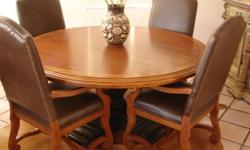 66" Round dining table cherry planked top, Pedestal base, will seat 8 comes with four
High back Leather and cherry chairs, like new, compare at over 6800.00 new.
561-688-3462