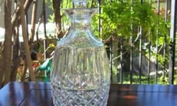 Beautiful high end crystal decanter. It is in excellent condition. It is ten and quarter inches in height.