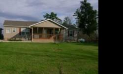 LOVELY 2006 MANUFACTURED HOME AND 17 ACRES..IN A VERY QUIET AREA..7MILES FROM TOWN....HAS BLACKTOP DRIVE ,FENCE..LAND HAS BUILDING SITES,WATER AND ALSO A BARN.....FLAT AND WOODED....REALLY MUST SEE TO APPERICATE THIS THIS LOVELY HOME....HAS GARAGE,CARPORT