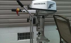 2005 HONDA BF5A 4 STROKE OUTBOARD MOTOR RUNS GREAT ,VERY LOW HOURS ,18INCH SHAFT WITH A FORWARD NEUTRAL AND REVERSE COMES WITH GAS TANK AND STAND/DOLLY