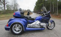 THE BIKE ITSELF IS A VERY NICE 2002 HONDA GOLDWING GL1800 WITH ONLY 26,805 MILES. IT IS PURPLE IN COLOR AND LOOKS BEAUTIFUL!&nbsp; IT HAS ALL OF THE STANDARD GOLDWING OPTIONS INCLUDING REVERSE, AM/FM RADIO, DRIVER-TO-PASSENGER INTERCOM SYSTEM, CRUISE