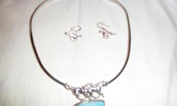 Silver with&nbsp; light blue stone in center earrings to match
Cash only
