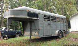 99 Chaparrel three horse slant load gooseneck with dressing room Seven foot tall box.Includes:New mattress,Two factory saddle racks and rubber stall mats.Pulls great.