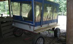 4 and a half by 8 ft wooden wagon with steel frame, Amish made top and curtains,4 bucket seats, shock style springs, 4 wheel brakes, aluminum wheels with 14 in new tires single shaves and double tree with tow bar, hitching post on back of wagon, this