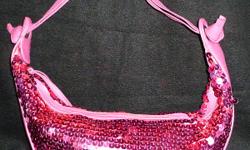 Hot pink sequined medium sized evening bag. EXCELLENT condition! Great for a night out
PayPal or Google Checkout accepted. I have a 100% seller rating on Ebay (under the account name of hollybee75)
Items ship within 3 business days / $7 flat shipping