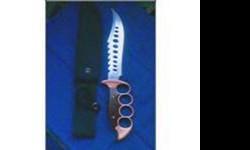 Knuckle grip hunting knife new with holster selling time 8am - 8pm no shipping cash only.