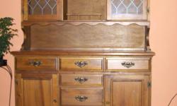 The hutch is medium dark wood. It stands 6 feet tall, 16.5 inches wide and 56.5 inches long. It is in excellent condition. A picture of the hutch is included in the add.
&nbsp;
