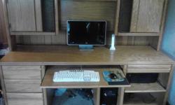 Soild Oak desk, 4 drawers, pull-out printer shelf. Lots of space for DVD's and CD's also has storage space for files. The desk is in great condition, we have 2 desks and need to get rid of one. Only call if you are serious about buying. Thank you. (Also