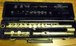 King flute with sterling silver head joint.&nbsp; Very good condition.&nbsp; Like new case.&nbsp; Suitable for high school or college student.
