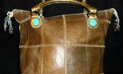 Italian Made Leather Purse - medium size, excellent condition inside and out. Canvas back, gold handles, taupe leather. Very unusual!
PayPal or Google Checkout accepted. I have a 100% seller rating on Ebay (under the account name of hollybee75)
FEEL FREE