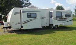 2012 jayco eagle 320 RLDS travel trailer 35' &nbsp;2 slides, walk around bed with full width closet. stand alone shower, large refridge, 42" flat screen tv, dinette with 4 chairs, couch pulls out to bed with air mattress, 2 swivel rocker recliners,