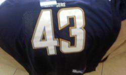 A San Diego Chargers Jersey. It is brand new and has never been worn. It is size 52 (XL). It is a dark blue n white color. It still has the tag n the plastic it came in.