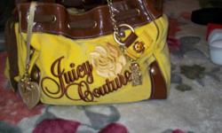 BEAUTIFUL YELLOW JUICY COUTURE BAG WITH LEATHER TRIMMING, LARGE HEART WITH DIAMONDS AND BOW ON FROM OF THE BAG, VERY FLASHY AND FUN! I HAVE A BLACK JUICY WALLET LARGE.&nbsp;I HAVE A BEAUTIFUL PAIR OF JUICY COUTURE SUNGLASSES WITH A CROWN ON THE ARM OF THE