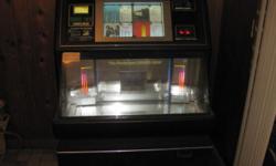 This is a great piece of equipment. Bar style juke box. Money handlers were removed before I got it, not a requirement for me. It holds 100 CD. I will deliver in the Charleston SC area for a small fee, depending on distance. No payments, cash deal.
