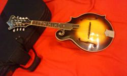 Don't let this one get by, want last long. kentucky f style sweet sounding mandolin very nice. with featherlite zipper case.