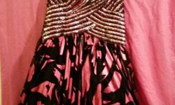 Beautiful one of a kind Formal Gown&nbsp;
Chiffon prom dress with Halter Neckline. Floor length with Sequin bodice and Corset back.
&nbsp;
SIZE 12 &nbsp; &nbsp; &nbsp; &nbsp; &nbsp; &nbsp; &nbsp; &nbsp; &nbsp; &nbsp; &nbsp; &nbsp; COLOR: Fushia & Black