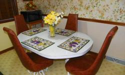 Lovely 6 foot white formica table with fancy white wrought iron legs, octagonal shape table with 4 cushioned high back brown chairs with fancy wrought iron legs,very sturdy, excellent condition, call 865-689-5217 or 423-426-6250