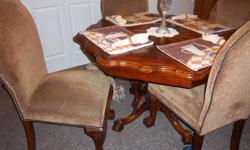 Solid Oak claw feet table and cloth chairs with claw feet.. Unique and different... To big for my small apt...