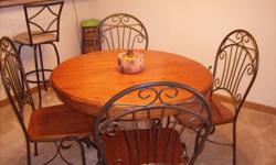7 piece kitchen table set with 12 in. table top extension
Wood table top with metal table base and 6 metal/wood chairs