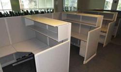 We have approximately 180 stations in 6 X 6 complete with glass stackers and some have taller panels in the spine and on end of workstations runs. They have a 24x36 corner, two 24x36 tops, a box/box/file and file/file full heighth and 72" overhead storage