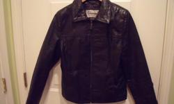 Black embossed lined leather jacket (from Wilsons Leather) zips up two side pockets. In perfect condition I woud say this is a medium fit.