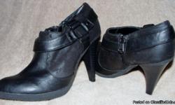 Ladies size 8.5 black leather/suede short boots, 4 inch heel,worn once indoors on carpet. Black leather with suede design, zipper. Can meet in Buford, Suwanee or Johns Creek