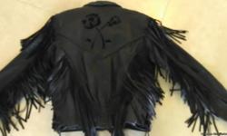 Leather jacket with fringes, rose emblem on back. Like new, size medium. Also have chaps with fringes and red CKX full head helmet, size medium. Pictures will be posted.