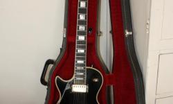 Left handed 1980 Gibson Les Paul Custom. Ebony with gold hardware. Very good condition. Orignal hard shell case included.