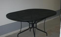 Beautiful wrought iron oval table and six chairs (four square back and two round back) for patio dining. Hardly used. In excellent condition. Must pick up in Old Town.