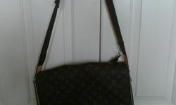 Beautiful, new and authentic LV bag that is very fashionable. Anyone would be proud to carry either their computer or use it as a cross body bag and hold all your stuff. The size is great for a travel bag as well . Comes with a dust cover. If any